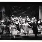 A chorus of people mid-dance in the YMCA Musical Society's 1970 production of Oklahoma